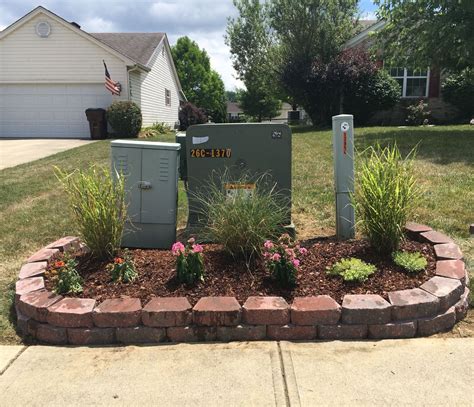 green electrical box in front yard|landscape around electrical transformer boxes.